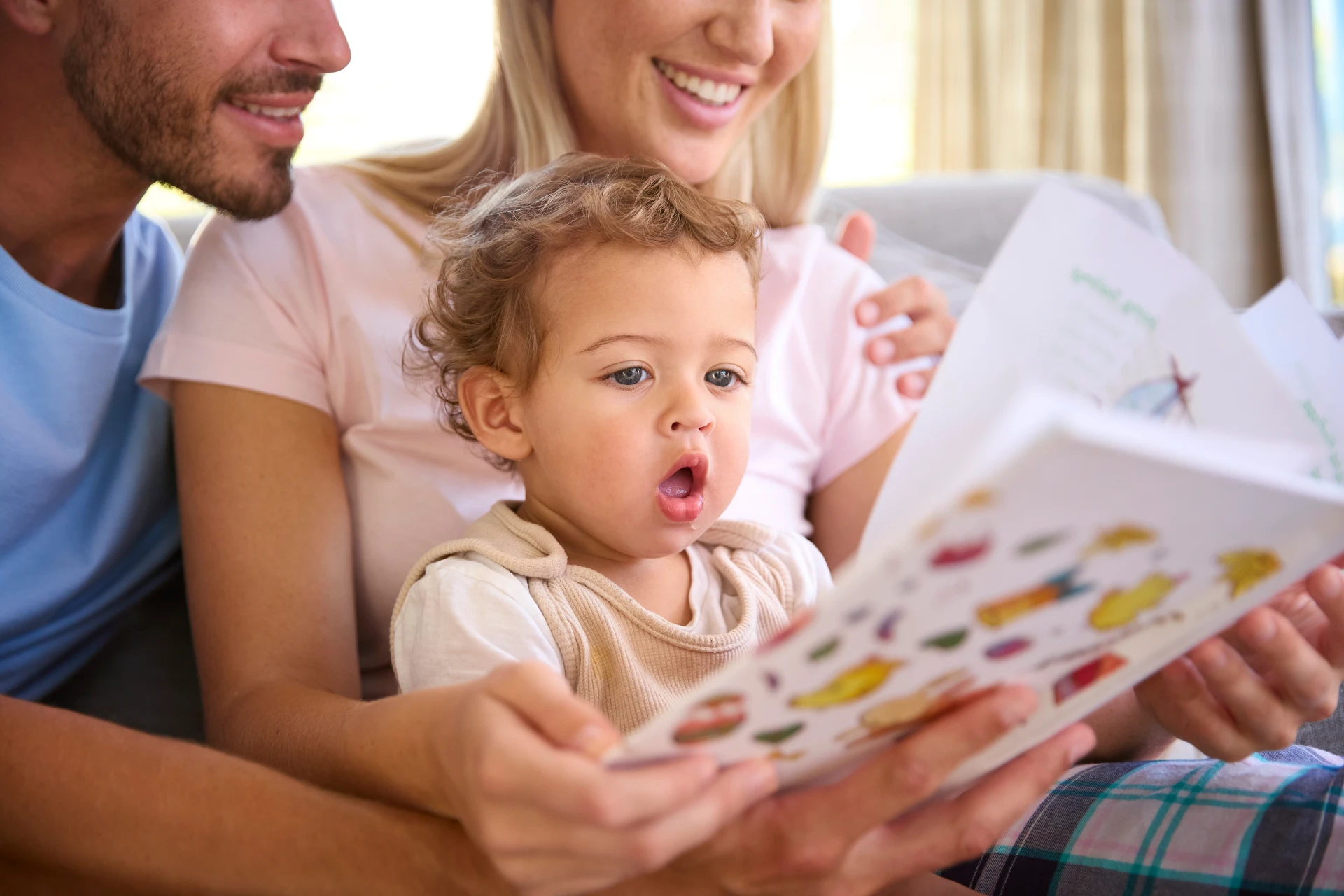 happy-family-reading-together-at-home